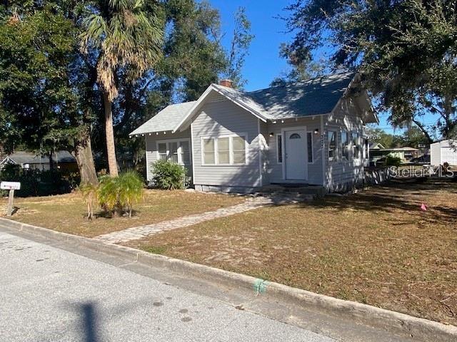 373 East Waldo Street Groveland, FL 34736 - Photo 1 of 23 a front view of a house with a garden