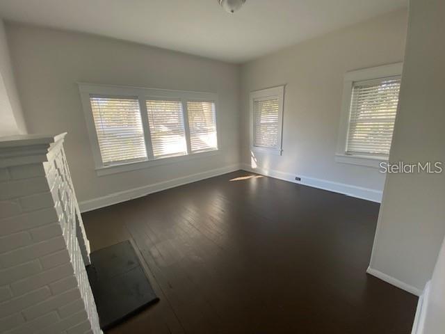 373 East Waldo Street Groveland, FL 34736 - Photo 19 of 23 a view of wooden floor and windows in a room