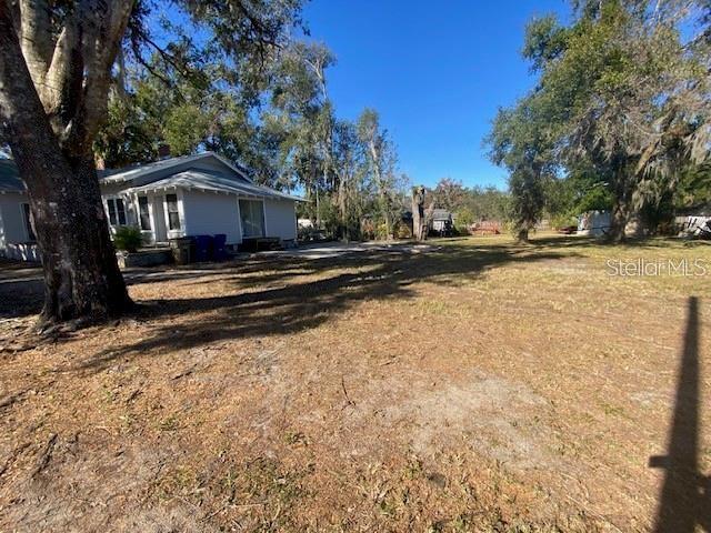 373 East Waldo Street Groveland, FL 34736 - Photo 5 of 23 a view of a house with a yard covered with snow in the background