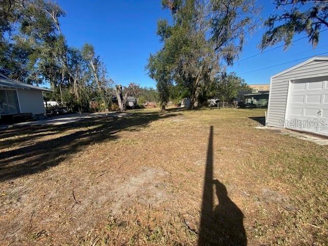 373 East Waldo Street Groveland, FL 34736 - Photo 6 of 23 a view of a yard with wooden fence