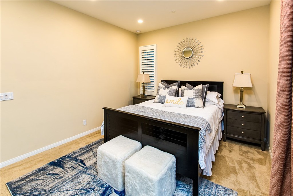 75 Gardenstone Path Irvine, CA 92620 - Photo 21 of 65 a bed room with a bed and a wall painting