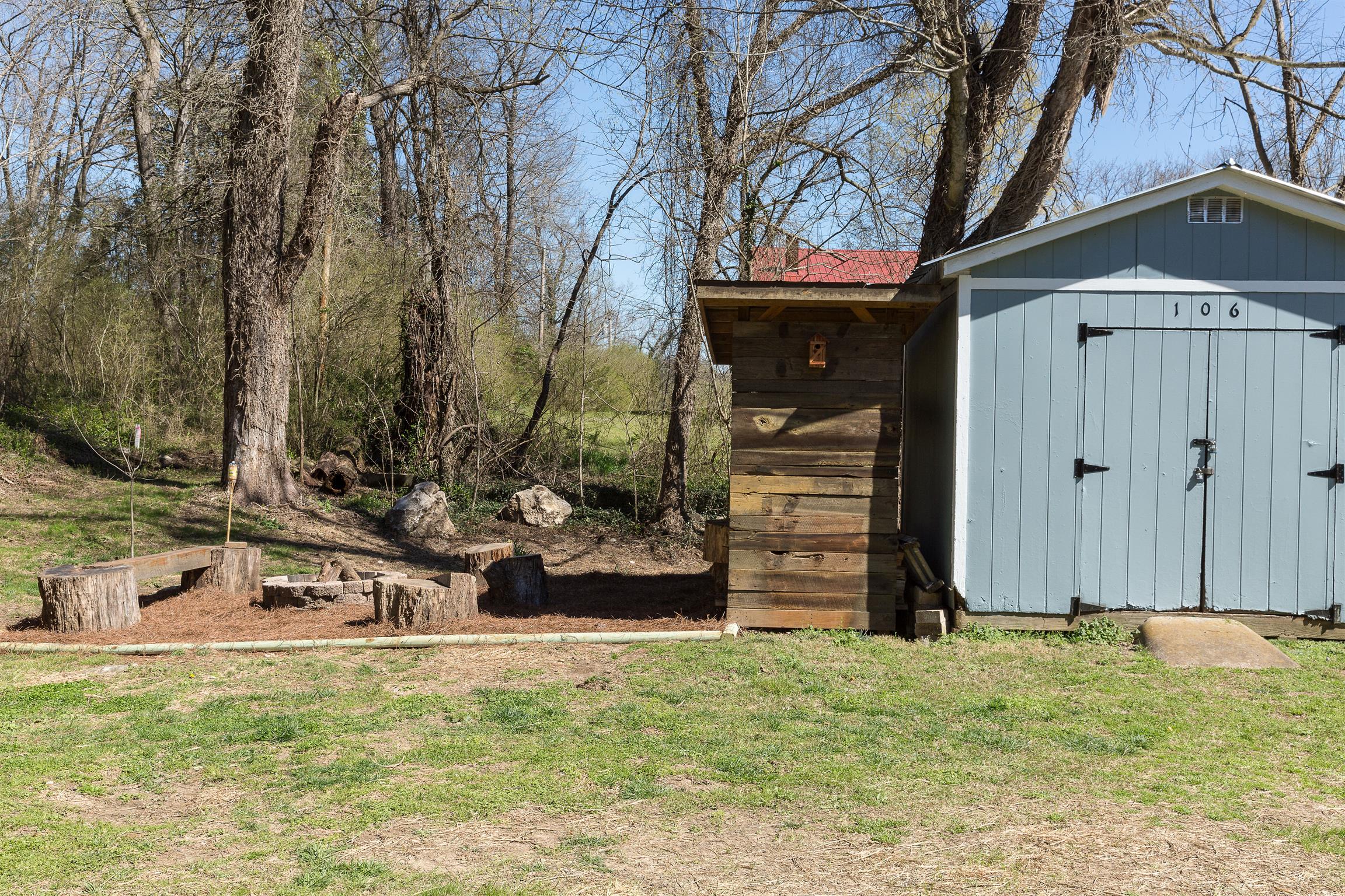106 Rinks Circle Columbia, TN 38401 - Photo 21 of 21 Storage building and fire pit area. Custom built wood shed stays.