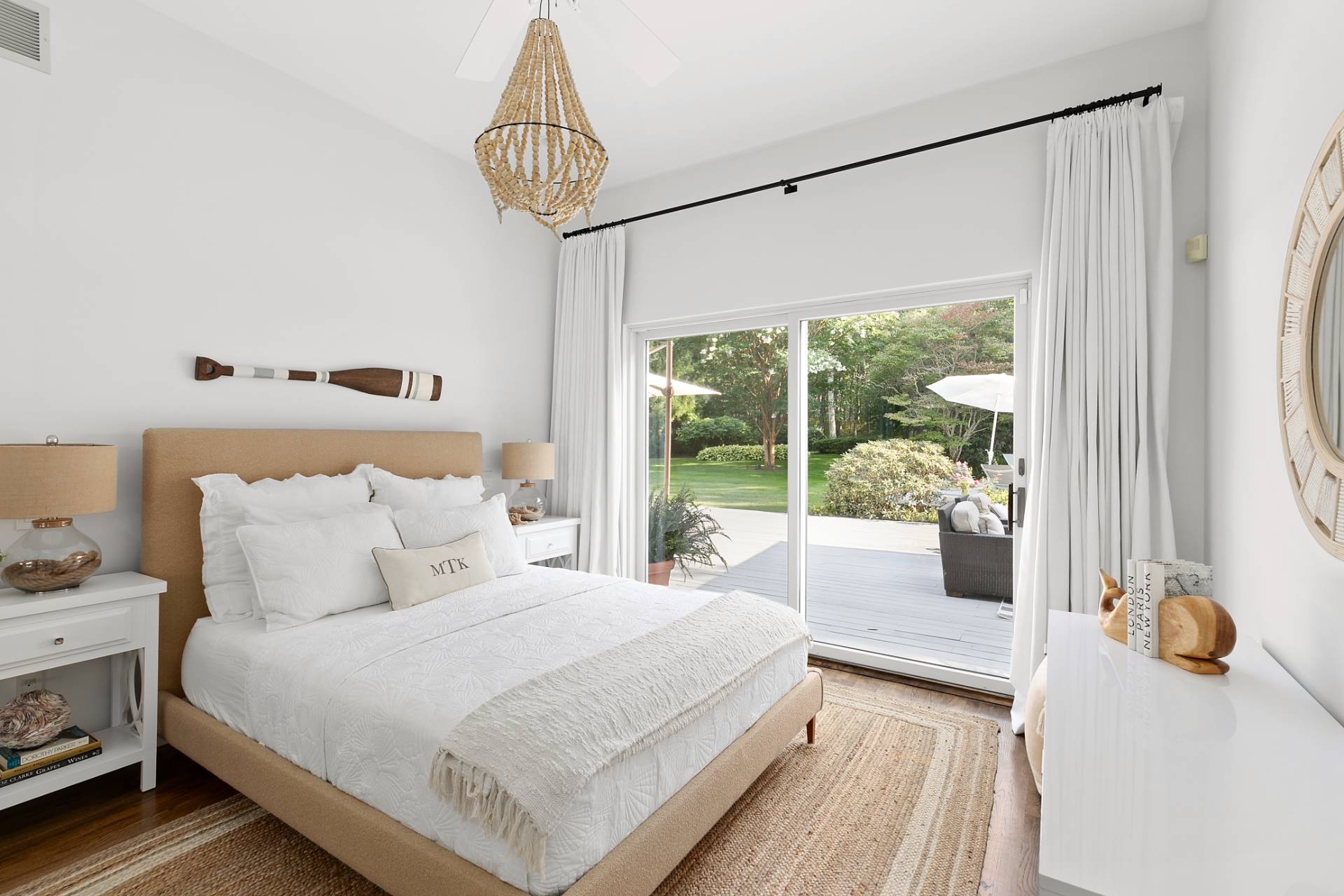 570 Rte 114 East Hampton, NY 11937 - Photo 12 of 30 a bedroom with bed and a window