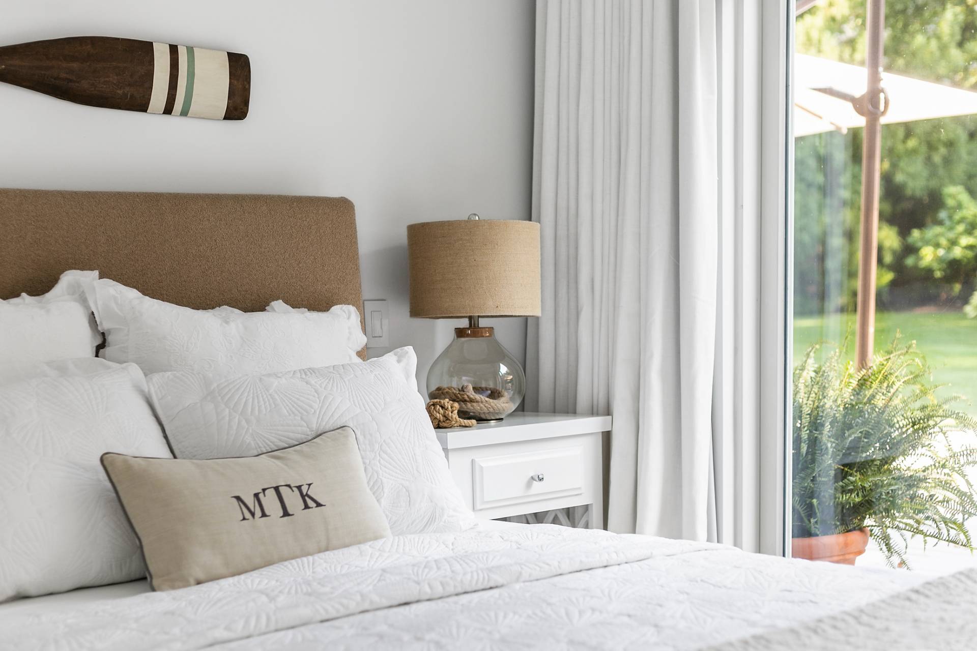 570 Rte 114 East Hampton, NY 11937 - Photo 13 of 30 a bedroom with a bed and a window