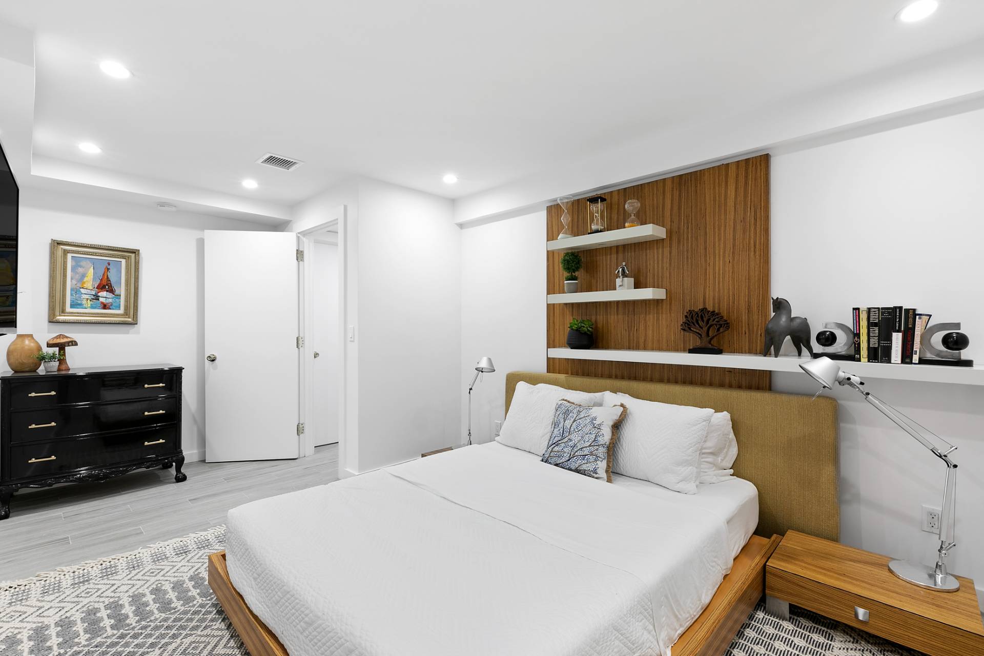 570 Rte 114 East Hampton, NY 11937 - Photo 16 of 30 a bedroom with a bed and a cabinets