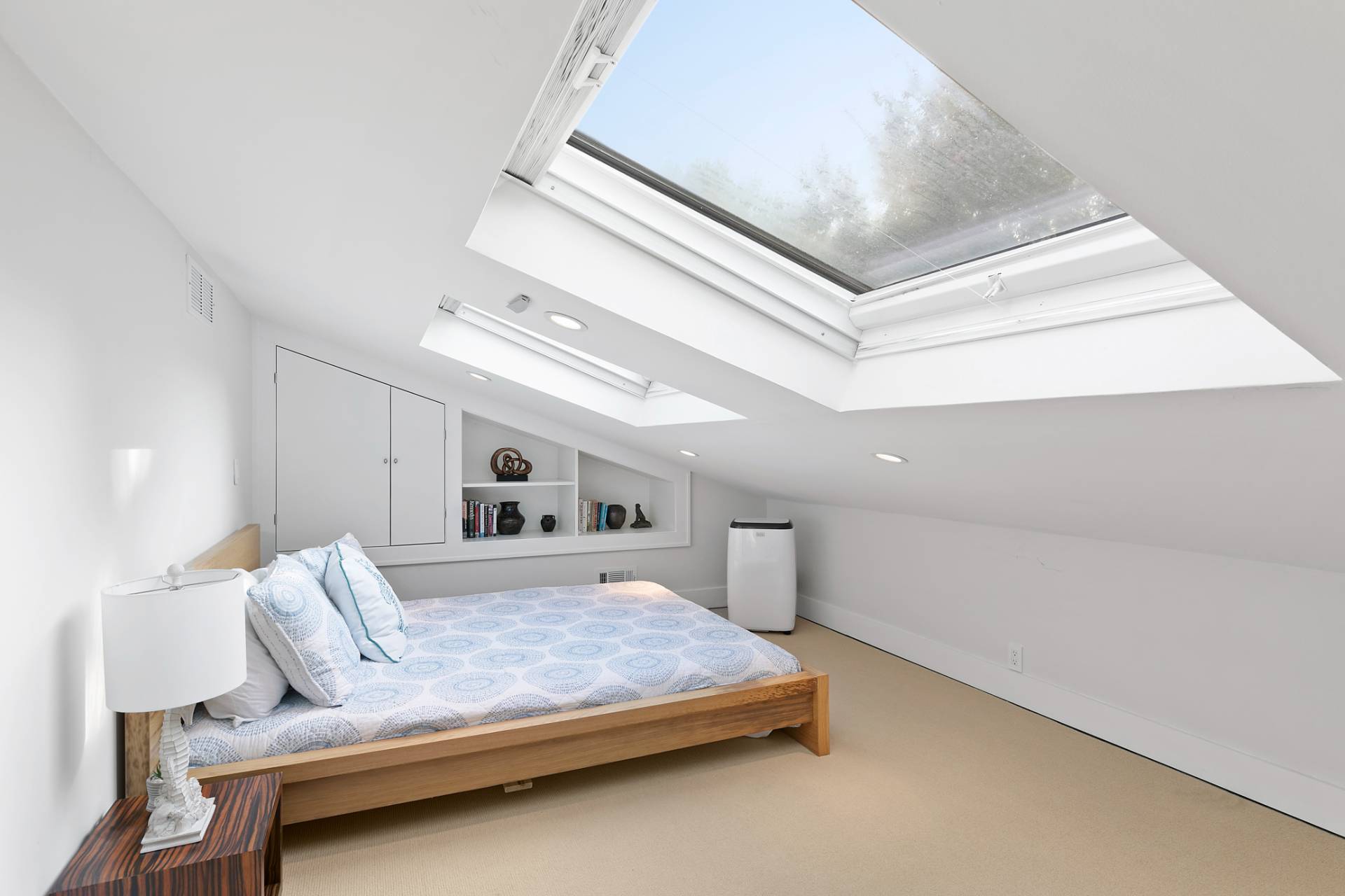 570 Rte 114 East Hampton, NY 11937 - Photo 17 of 30 a bedroom with a bed and window