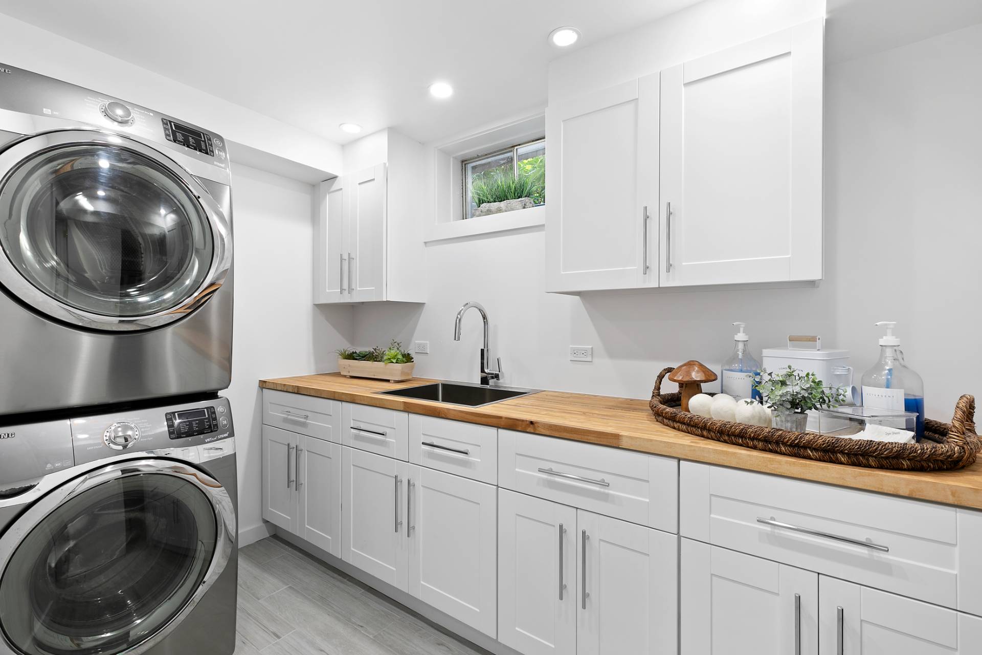 570 Rte 114 East Hampton, NY 11937 - Photo 22 of 30 a kitchen with a sink and a stove top oven