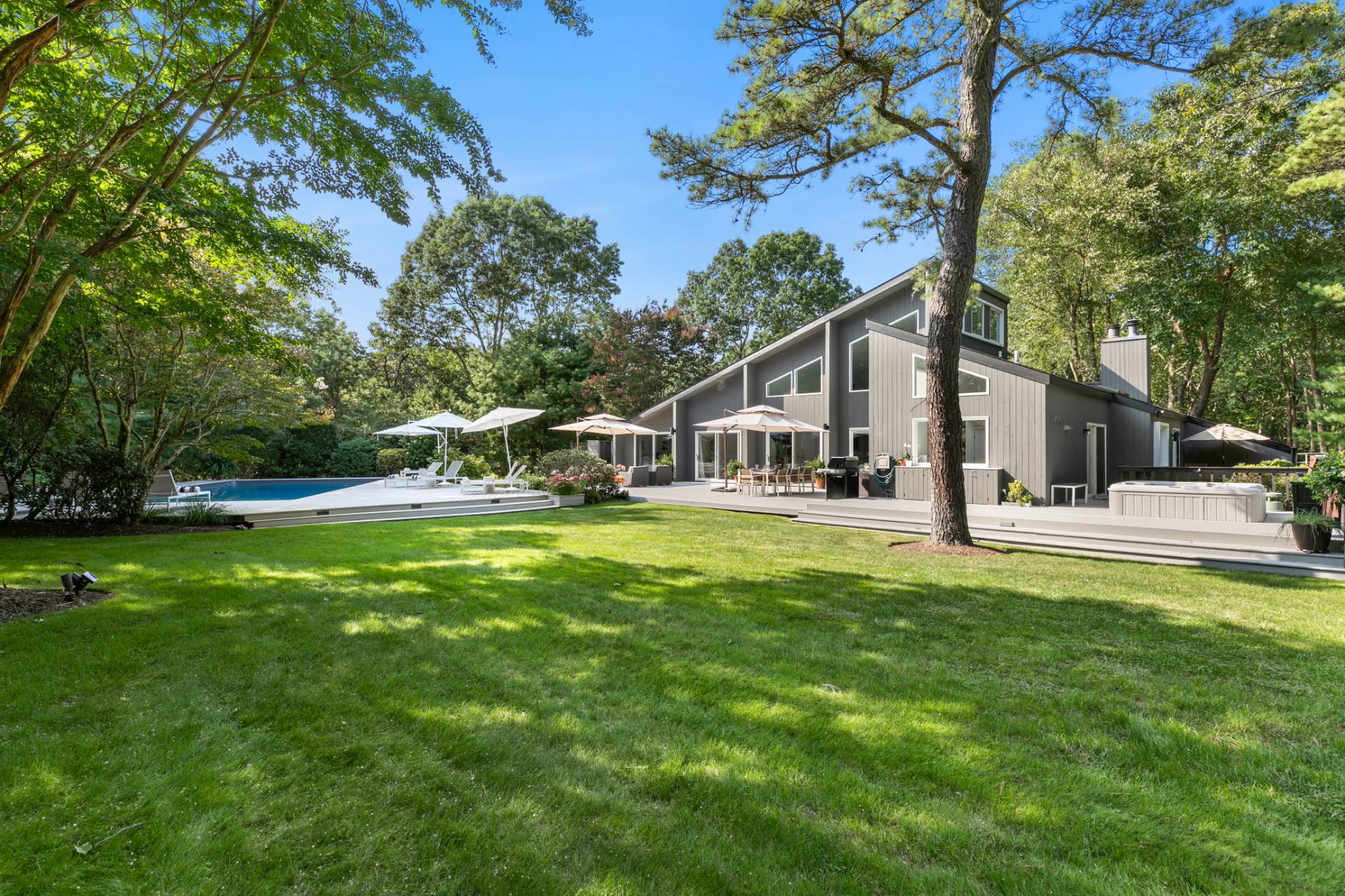 570 Rte 114 East Hampton, NY 11937 - Photo 26 of 30 a view of a house with a yard porch and sitting area