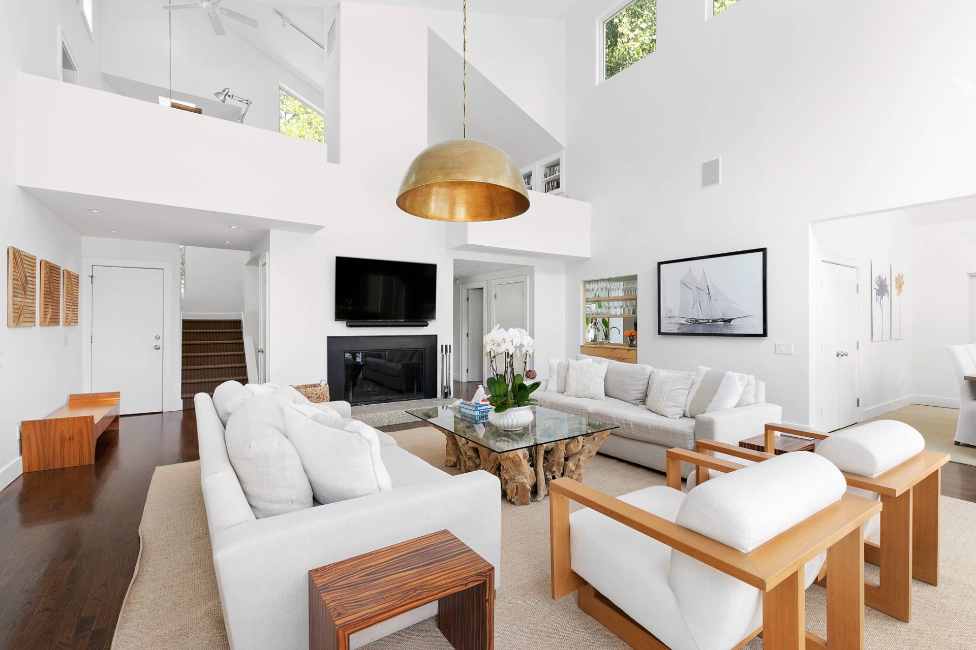 570 Rte 114 East Hampton, NY 11937 - Photo 4 of 30 a living room with furniture and a flat screen tv