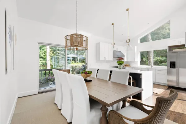 a view of a dining room with furniture window and outside view