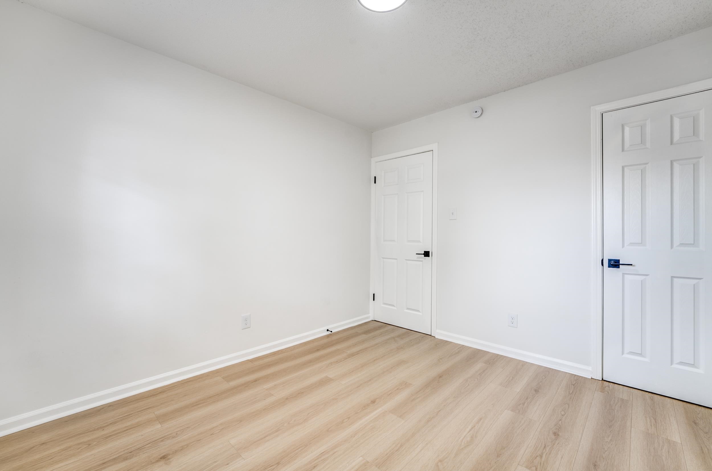 5156 Windcrest Road Memphis, TN 38116 - Photo 12 of 24 Unfurnished bedroom with light wood-style floors and baseboards