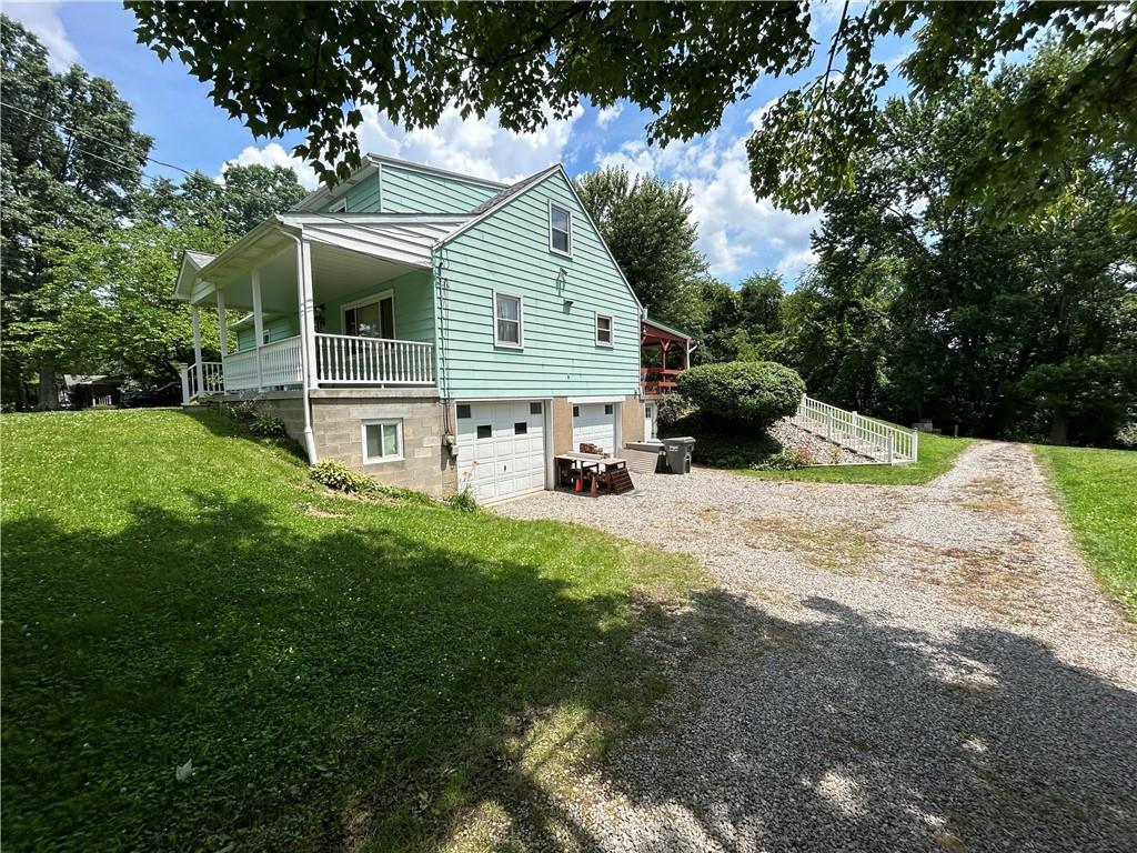 111 Iseman Road Freeport, PA 16229 - Photo 5 of 50 a view of backyard with a garden and deck