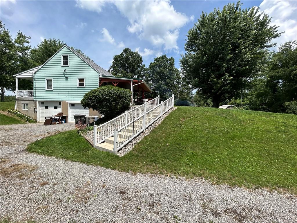 111 Iseman Road Freeport, PA 16229 - Photo 8 of 50 a front view of a house with a yard and garage