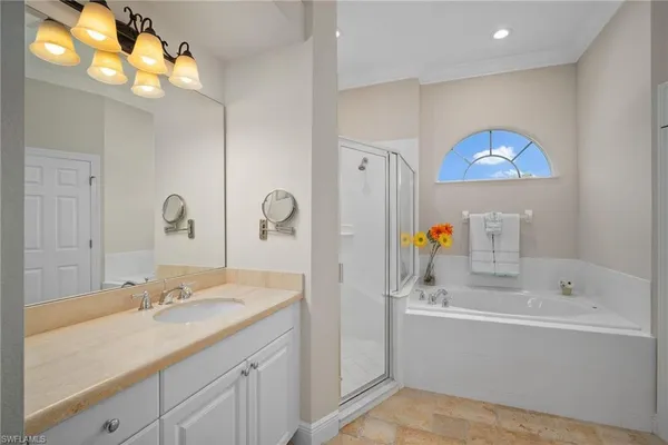 a bathroom with a sink double vanity and a mirror