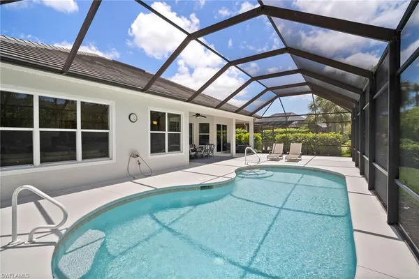 a house with swimming pool in front of it