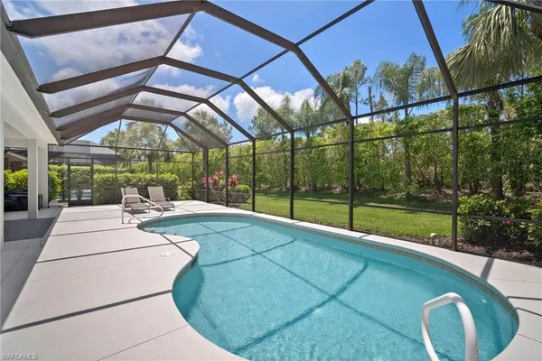 a view of a dining room with furniture wooden floor and a yard