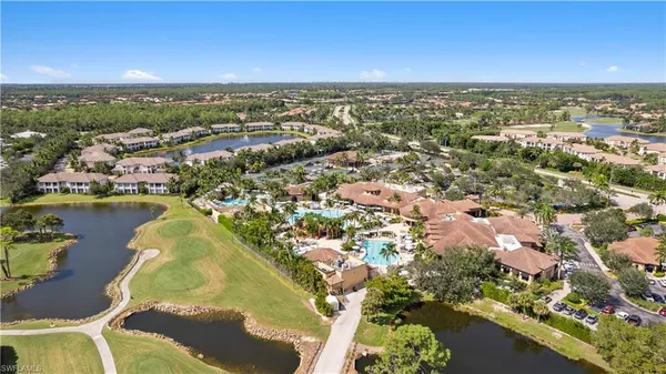 an aerial view of a house with a lake view