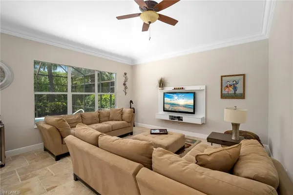a living room with furniture and a window