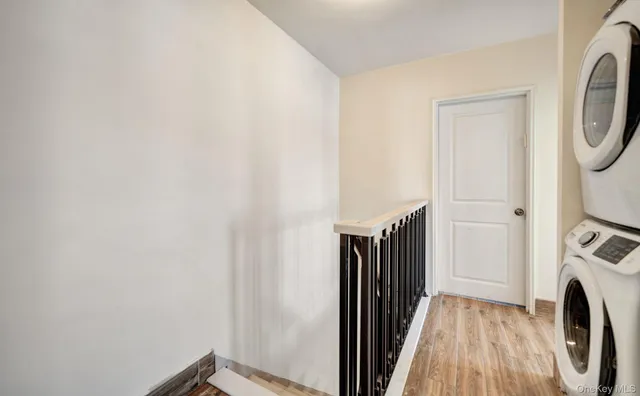 a view of a storage and utility room with washer and dryer