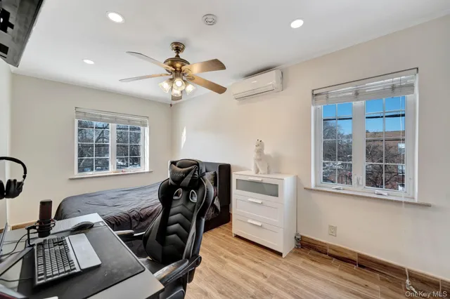 a bedroom with a bed and a desk