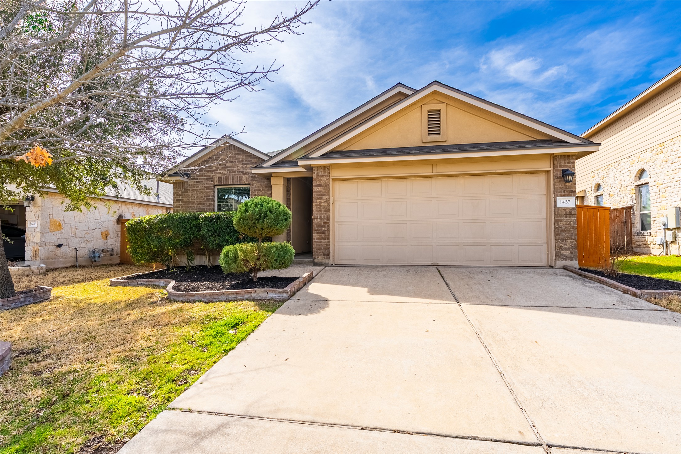 1437 April Meadows Loop Georgetown, TX 78626 - Photo 1 of 31 a front view of a house with a yard and garage