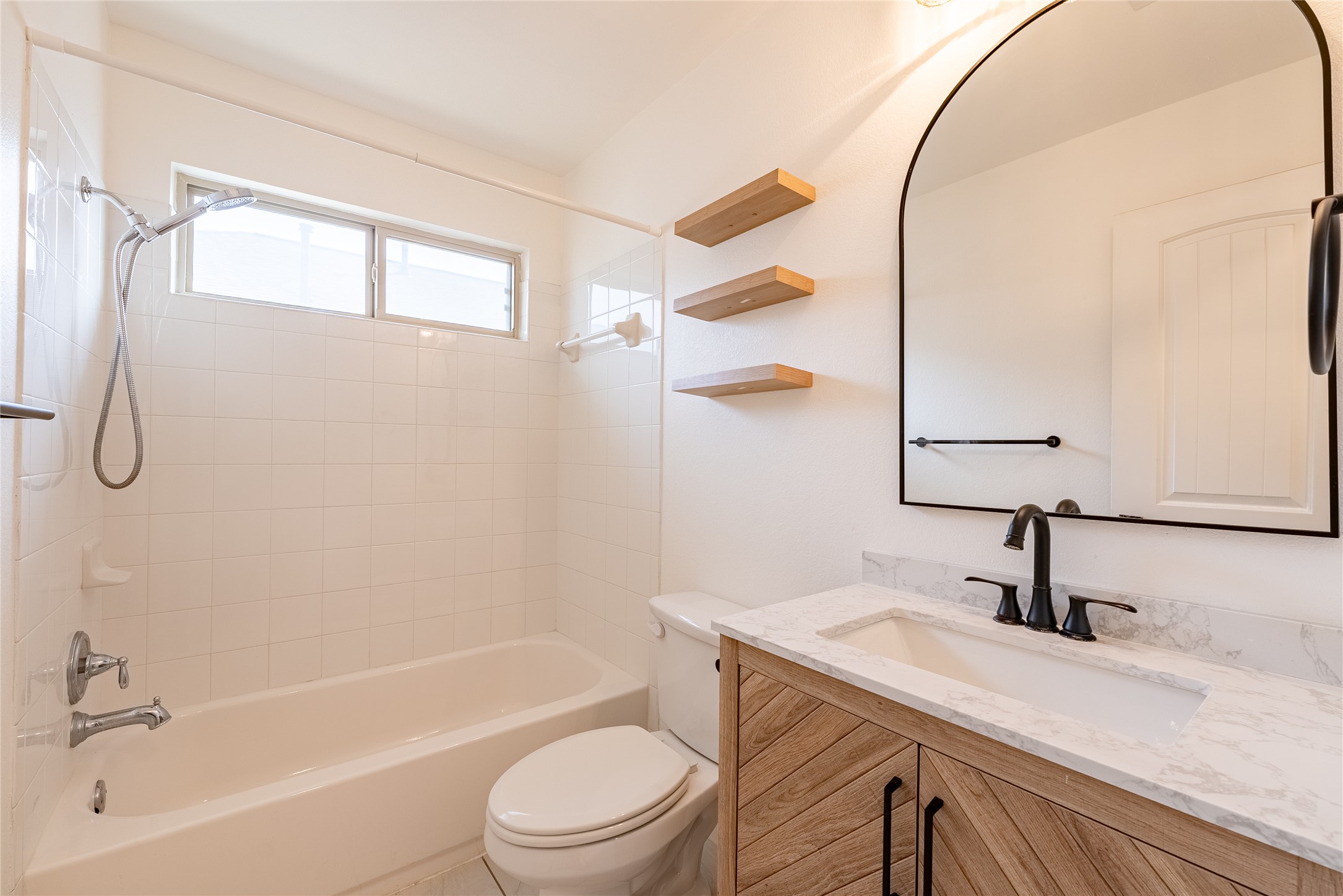 1437 April Meadows Loop Georgetown, TX 78626 - Photo 12 of 31 a bathroom with a sink a toilet and bathtub