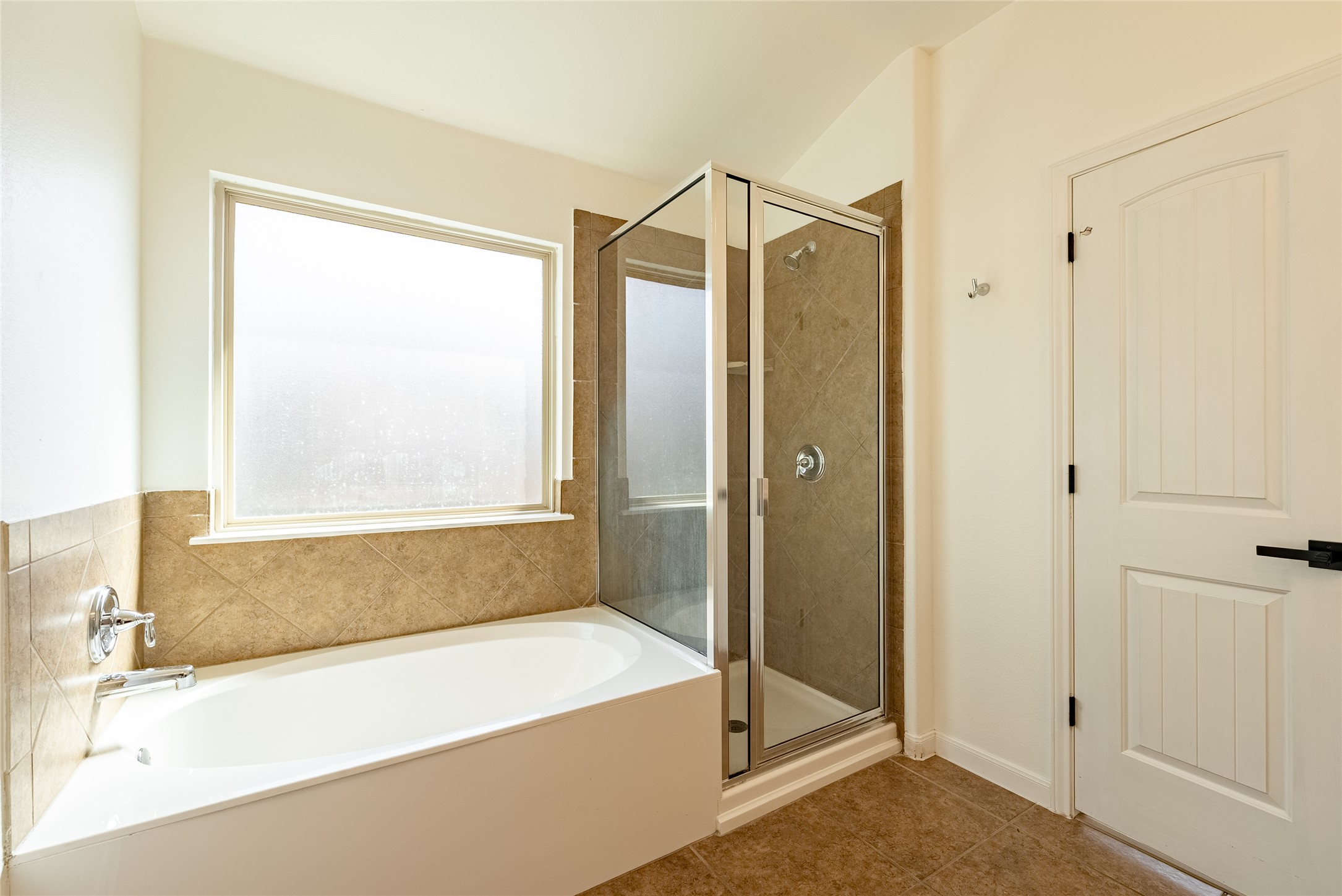 1437 April Meadows Loop Georgetown, TX 78626 - Photo 15 of 31 a bathroom with a bathtub and a shower