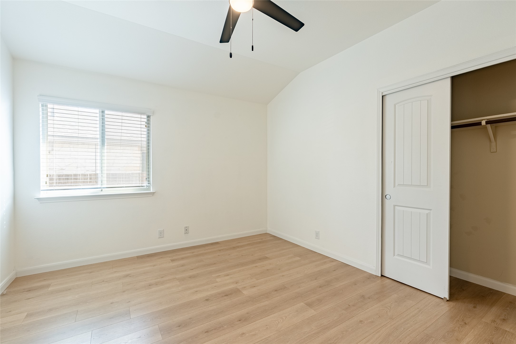 1437 April Meadows Loop Georgetown, TX 78626 - Photo 19 of 31 an empty room with wooden floor closet and windows