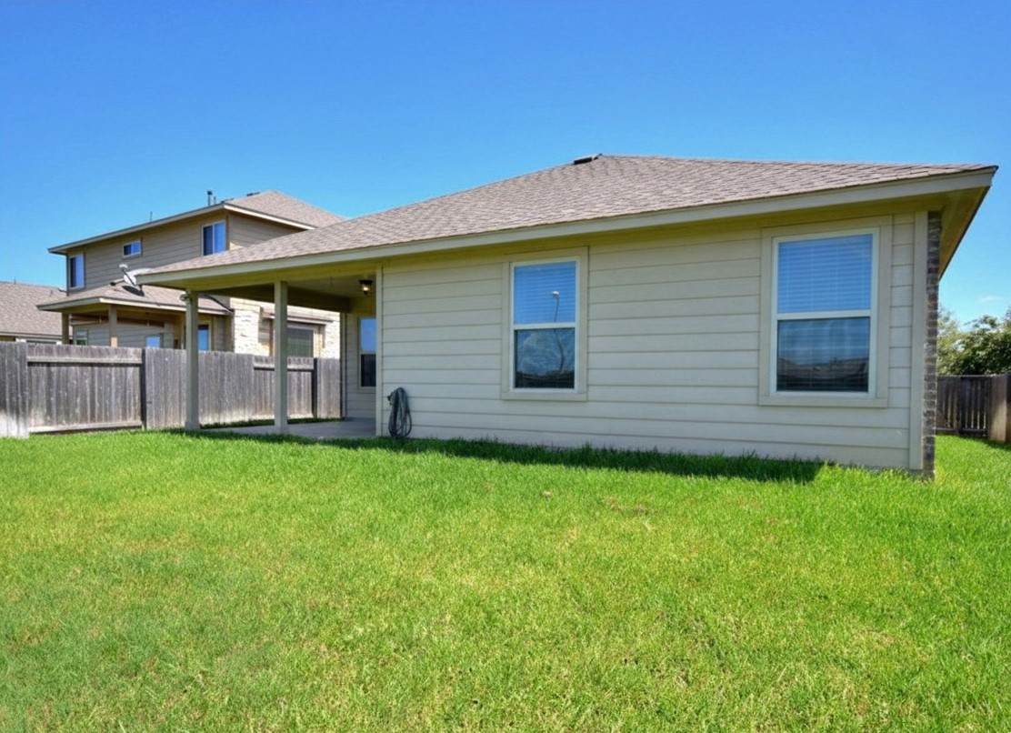 1437 April Meadows Loop Georgetown, TX 78626 - Photo 23 of 31 a view of a house with a backyard