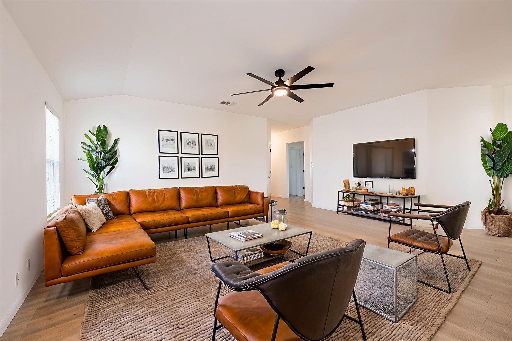 1437 April Meadows Loop Georgetown, TX 78626 - Photo 3 of 31 a living room with furniture and a flat screen tv
