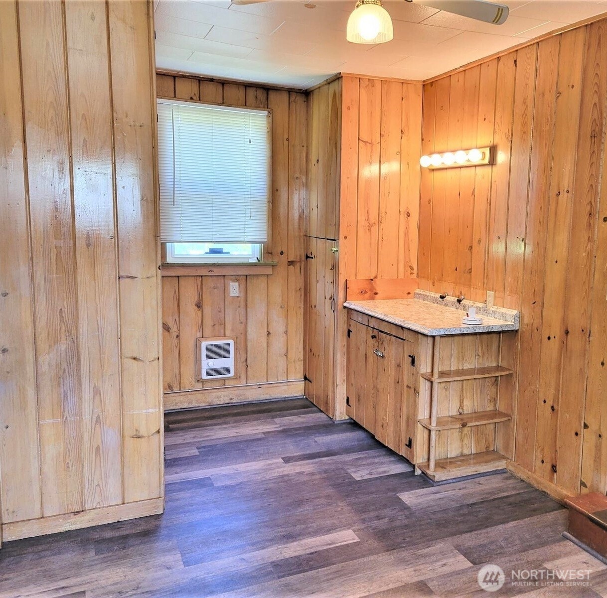2507 Erlands Point Road Northwest Bremerton, WA 98312 - Photo 6 of 8 an empty room with wooden floor and windows