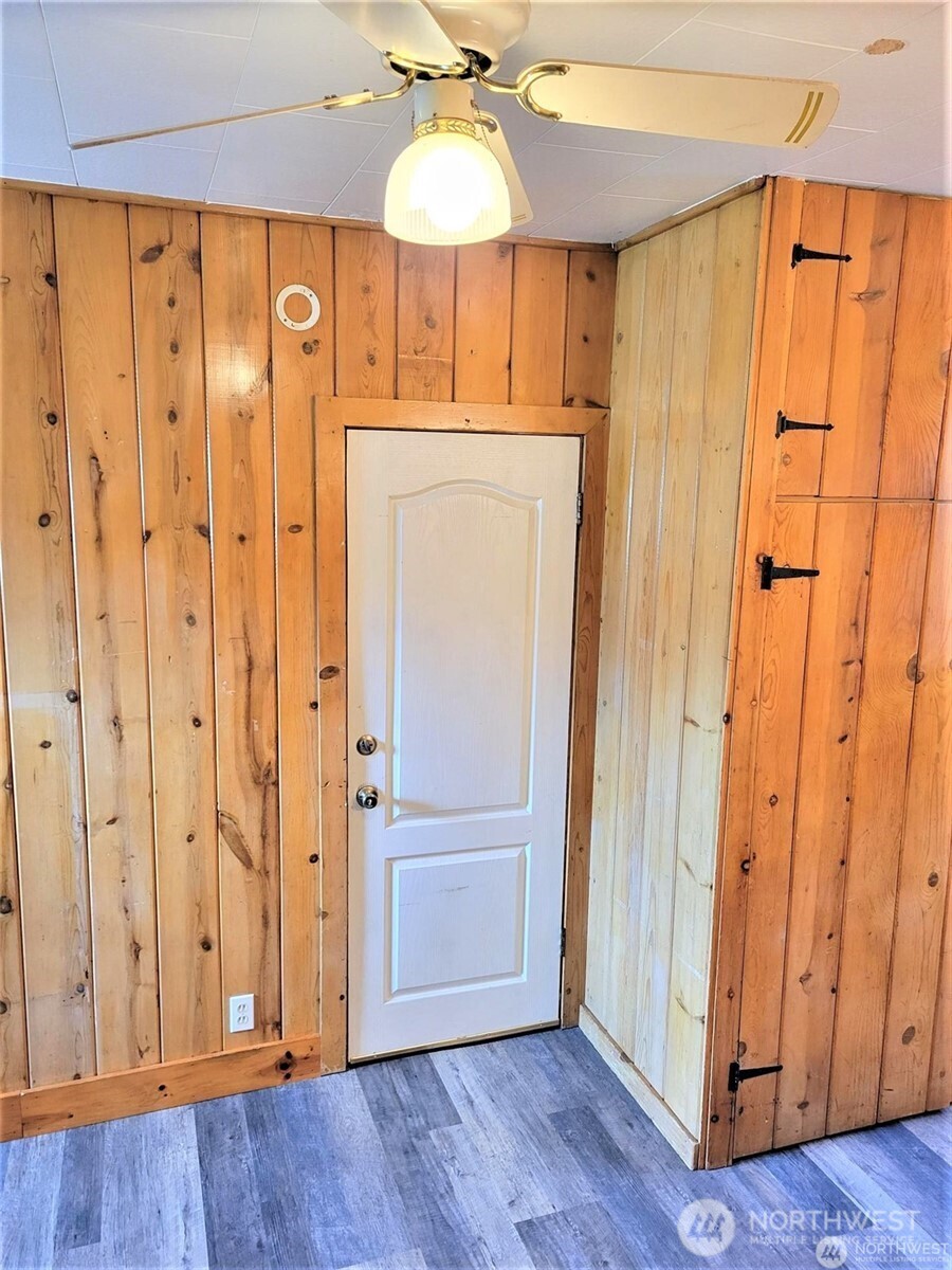 2507 Erlands Point Road Northwest Bremerton, WA 98312 - Photo 7 of 8 a view of a hallway with wooden floor