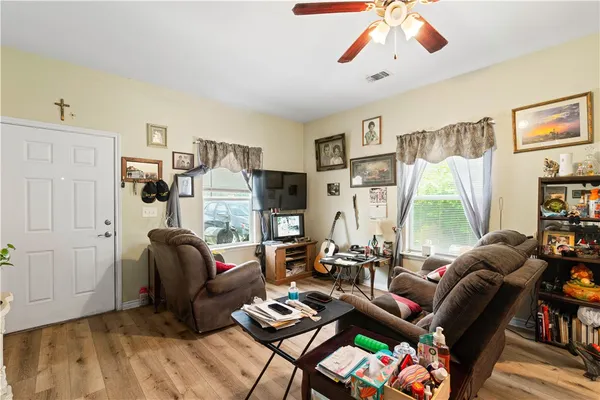 a living room with furniture and a large window