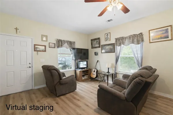 a living room with furniture and a fireplace