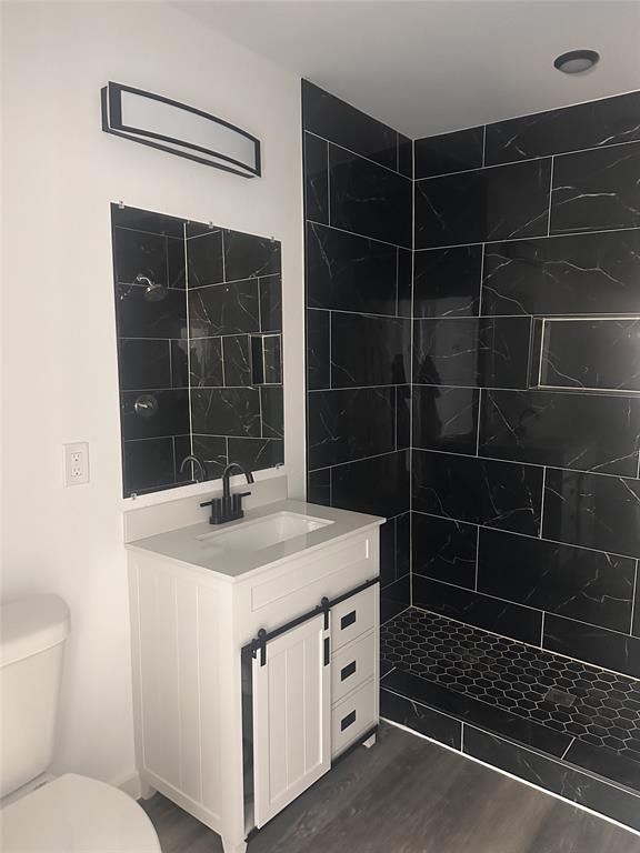 824 North Virginia Street Terrell, TX 75160 - Photo 12 of 21 a bathroom with a sink toilet and shower