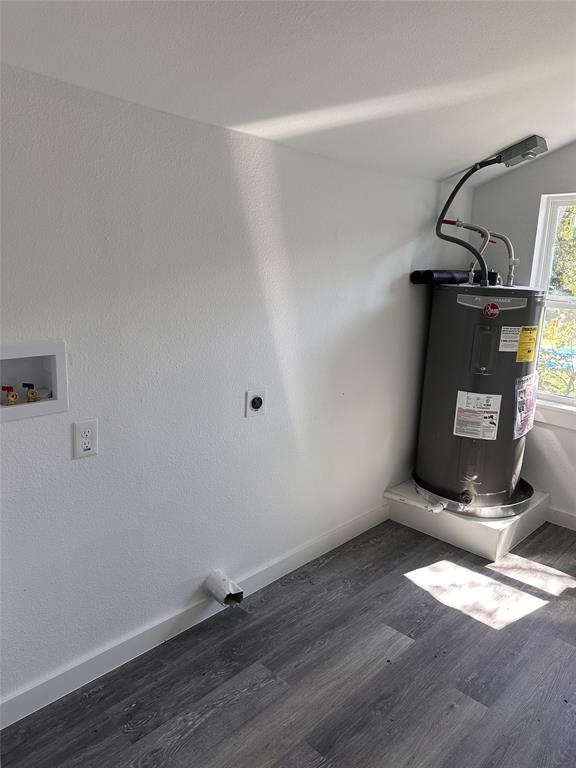 824 North Virginia Street Terrell, TX 75160 - Photo 15 of 21 an empty room with wooden floor and windows