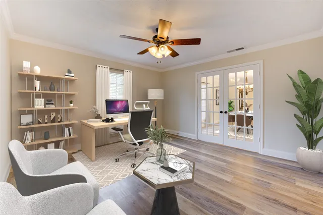 a view of a dining room with a table and chairs