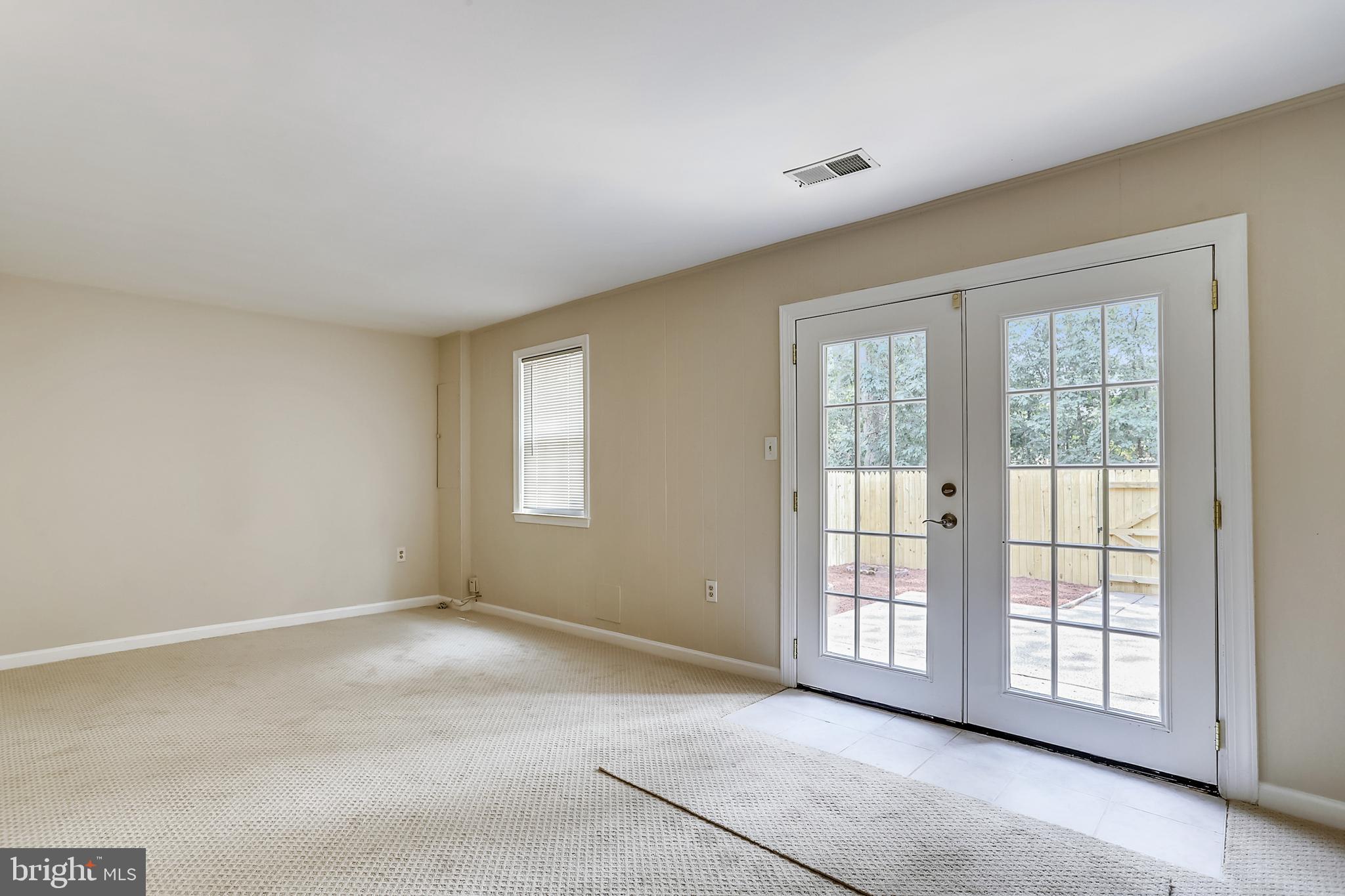 7025 Leebrad Street Springfield, VA 22151 - Photo 23 of 32 Ample Rec Room with French Door & new carpet.