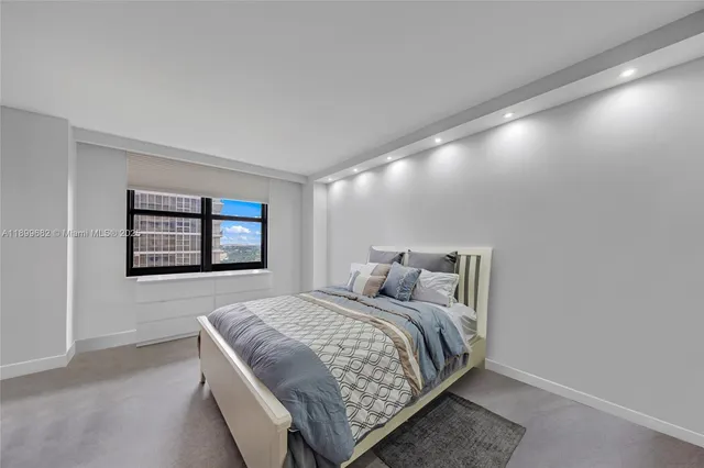 a bedroom with a bed and wall painting