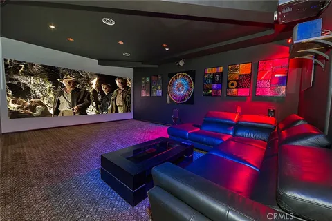 a room with a bed and a book shelf