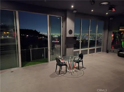 a living room with furniture a rug and a window