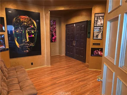 a room with gym equipment and a large mirror