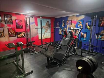 a bed room with a bed and a tv