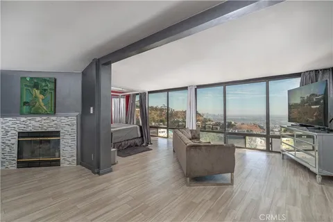 a living room with furniture flat screen tv and a fireplace