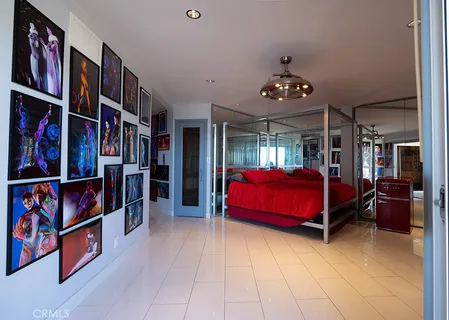 a view of a balcony with chairs and wooden floor