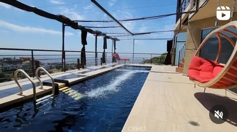 a view of a balcony with chairs