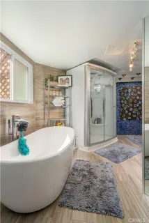 a white bath tub sitting in a bathroom