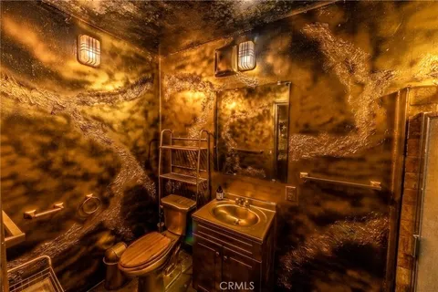 a view of a room with a dining table chairs and a fire pit