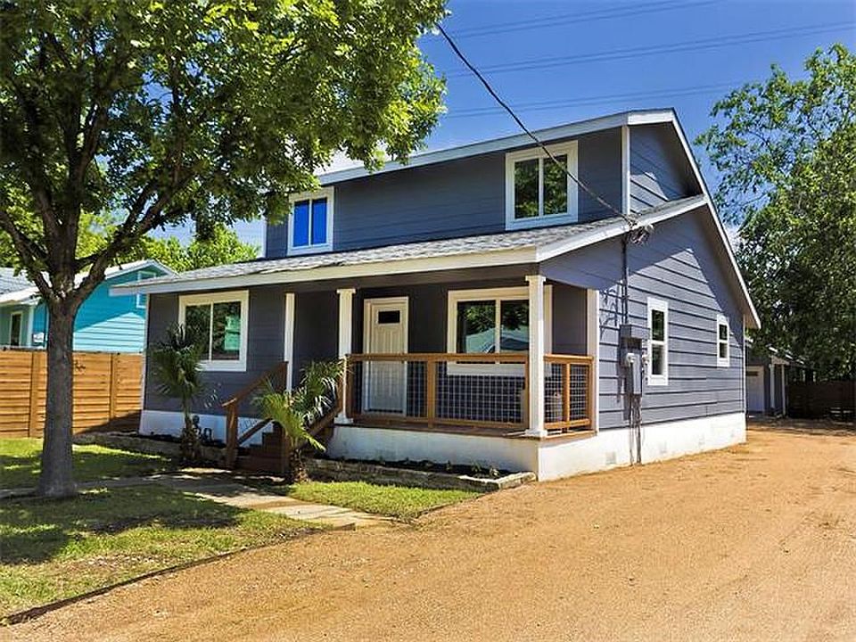 Undisclosed Address Austin, TX 78721 - Photo 2 of 36 Bungalow-style home featuring a porch and a garage