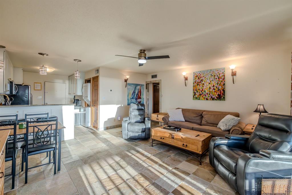 1655 Cedar Crest Loop, Unit E7 Graford, TX 76449 - Photo 11 of 35 a living room with furniture and kitchen view